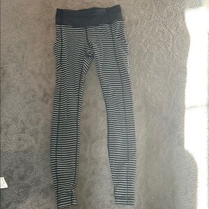 Striped Leggings - Black and White side pockets and back sipper pocket.